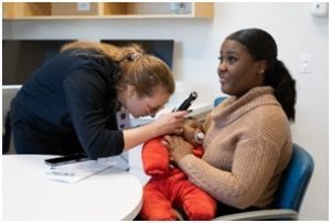 Audiologist Examining the child Ear